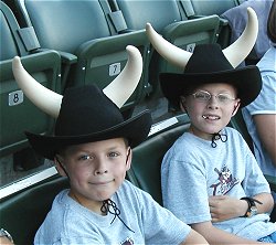 Photo of kids wearing horned cowboy hats